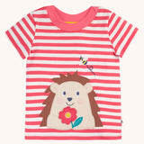 Frugi Easy On pink breton stripe hedgehog applique short sleeved organic cotton T-Shirt. The hedgehog is holding a pink flower and there is a little bee flying above.