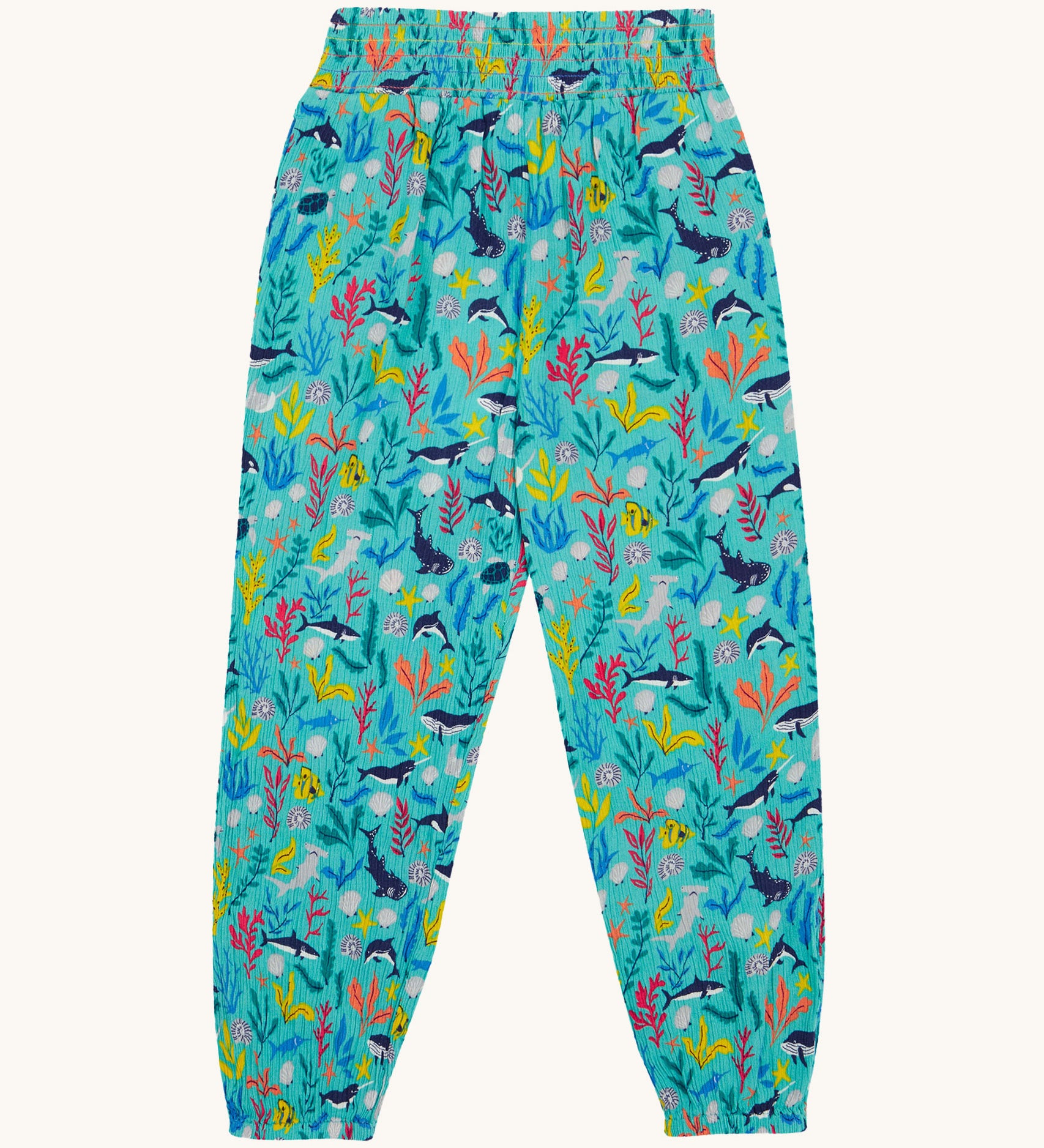 Frugi Eira Harems laid flat, featuring a Sea Life print which includes different sea animals and colourful seaweed and coral on a mint blue background.