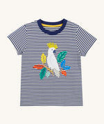 Frugi Elijah Applique T-Shirt in Navy Blue Stripe laid flat, with an embroidered Cockatoo in the centre and a navy blue collar.