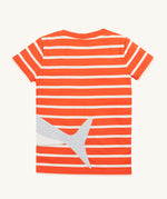 Frugi Elijah Wrap Around T-Shirt in Orange Stripe laid flat, featuring an embroidered shark's tail.