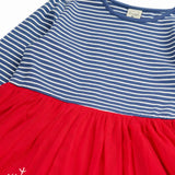 Close up of the Frugi emmie skater dress with a long sleeved navy stripe top half and red robin applique tulle  skirt.