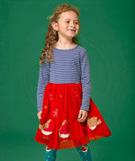 Child wearing the Frugi emmie skater dress with a long sleeved navy stripe top half and red robin applique tulle  skirt.