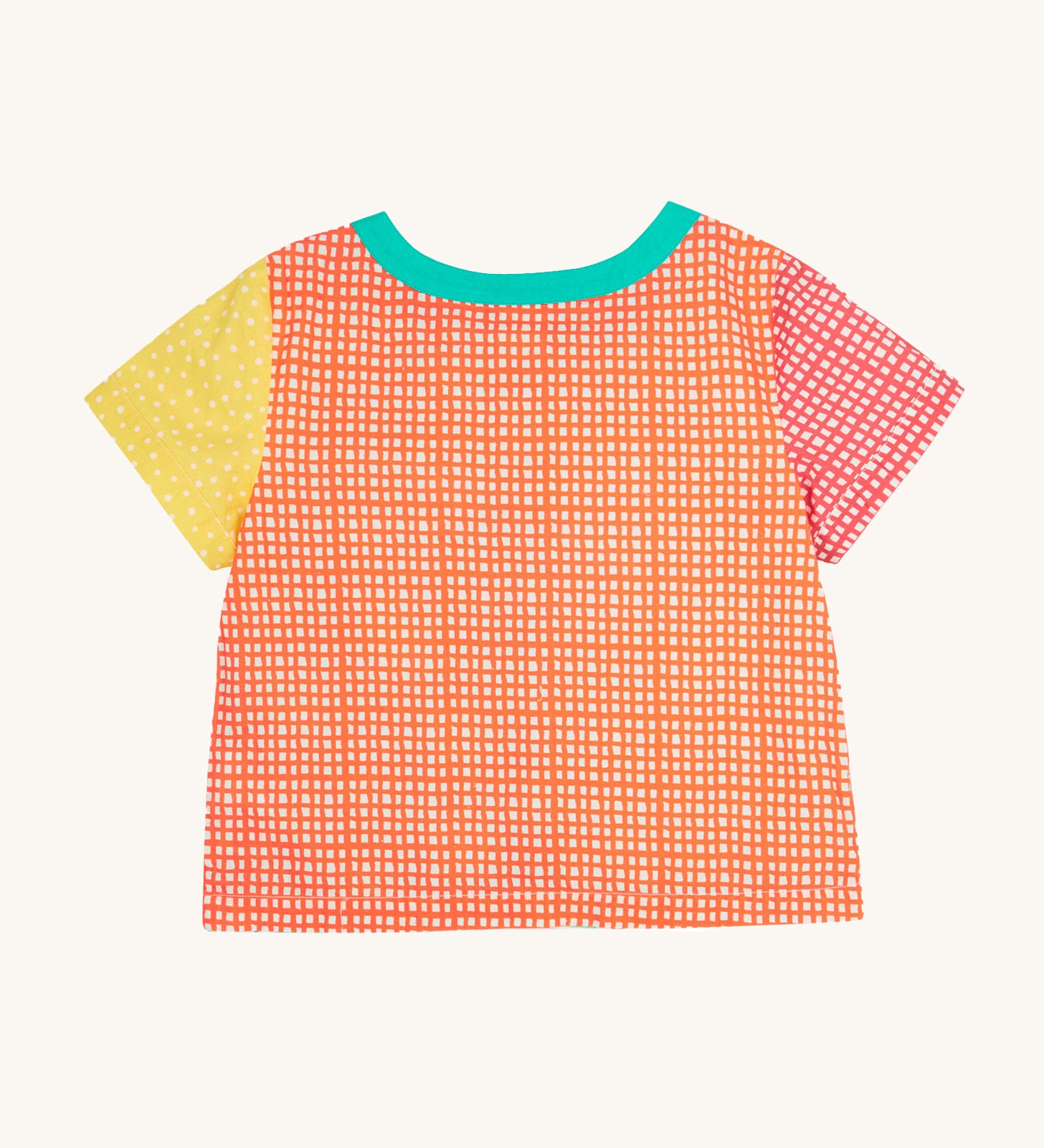 The back of the Frugi Estella Shirt laid flat, with a Rainbow Hotchpotch print, a patchwork type design in red, orange and yellow, with a mint collar.