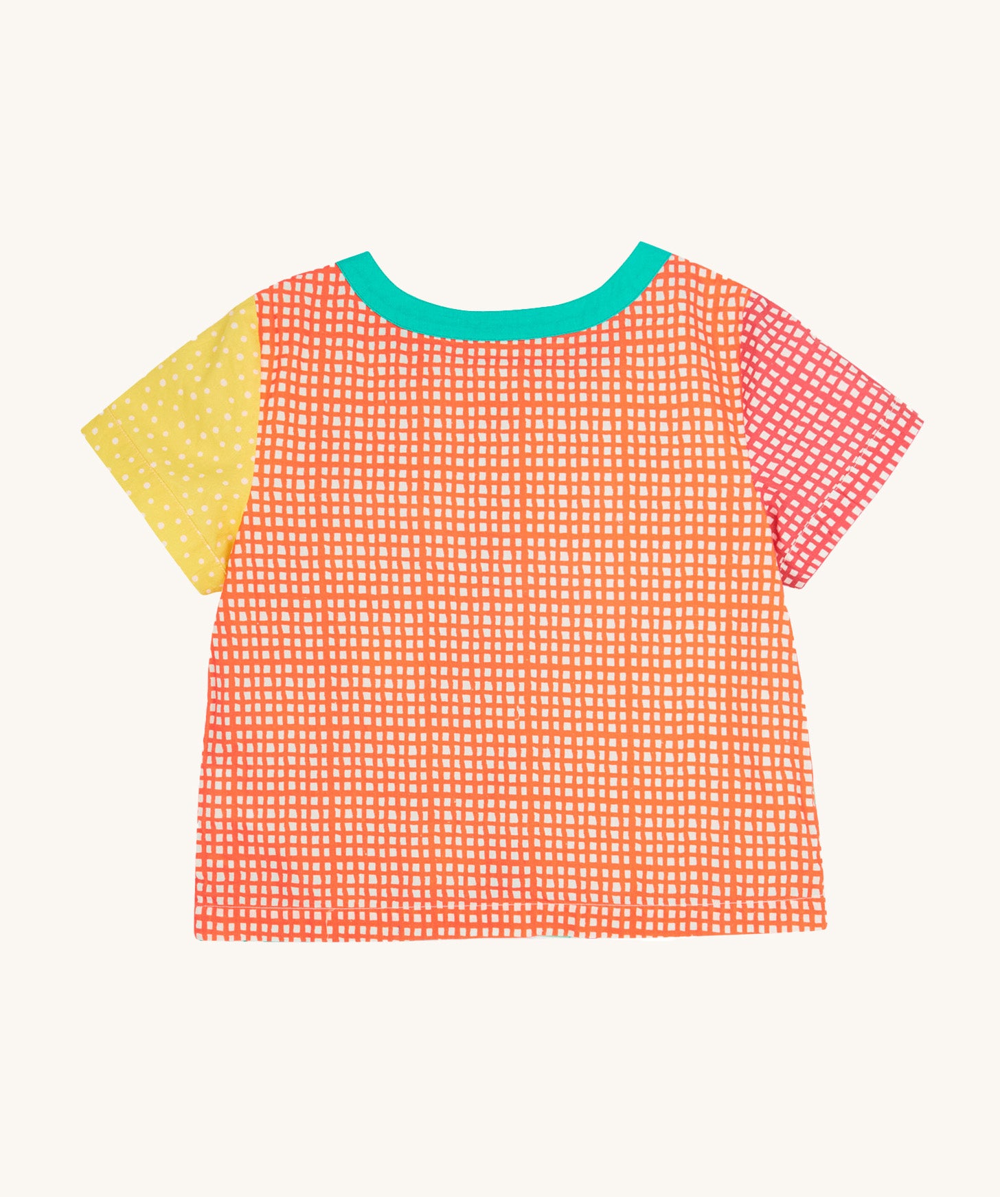 The back of the Frugi Estella Shirt laid flat, with a Rainbow Hotchpotch print, a patchwork type design in red, orange and yellow, with a mint collar.
