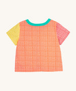 The back of the Frugi Estella Shirt laid flat, with a Rainbow Hotchpotch print, a patchwork type design in red, orange and yellow, with a mint collar.
