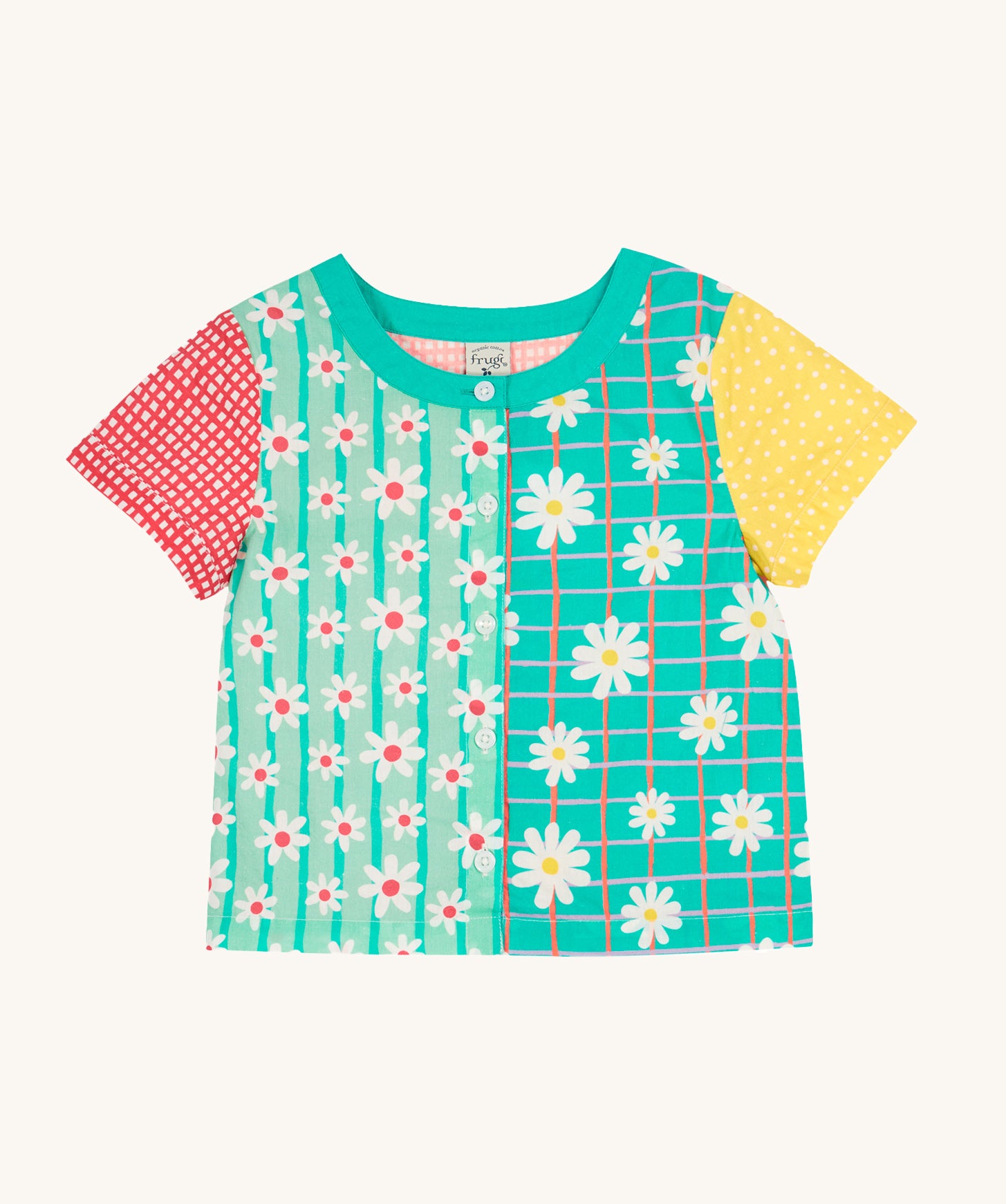 Frugi Estella Shirt laid flat, with a Rainbow Hotchpotch print, a patchwork type design in red, mint, green and yellow with daisies and white buttons down the middle.