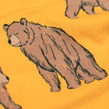 A close up of the Frugi kids Ethan printed sweater in beary wild. Showing the brown bear print detail on dark yellow organic cotton fabric.