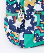 A close up of the Frugi magic stars explorer backpack showing the bottle holder, compartment zips and the playful outer space inspired print detail