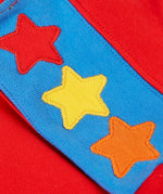 Close up of the three star appliques on the shoulders of the Frugi Falmouth scarlet red sweatshirt.