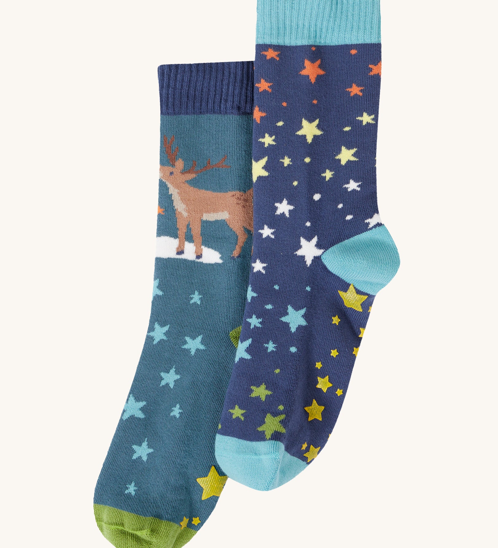 Frugi Festive Reindeer Great Organic Cotton Grippy Socks for Kids 2 Pack. These socks have green coloured grippy stars on the soles. These socks are part of a wide range of organic cotton clothing for children available here at Babipur. 