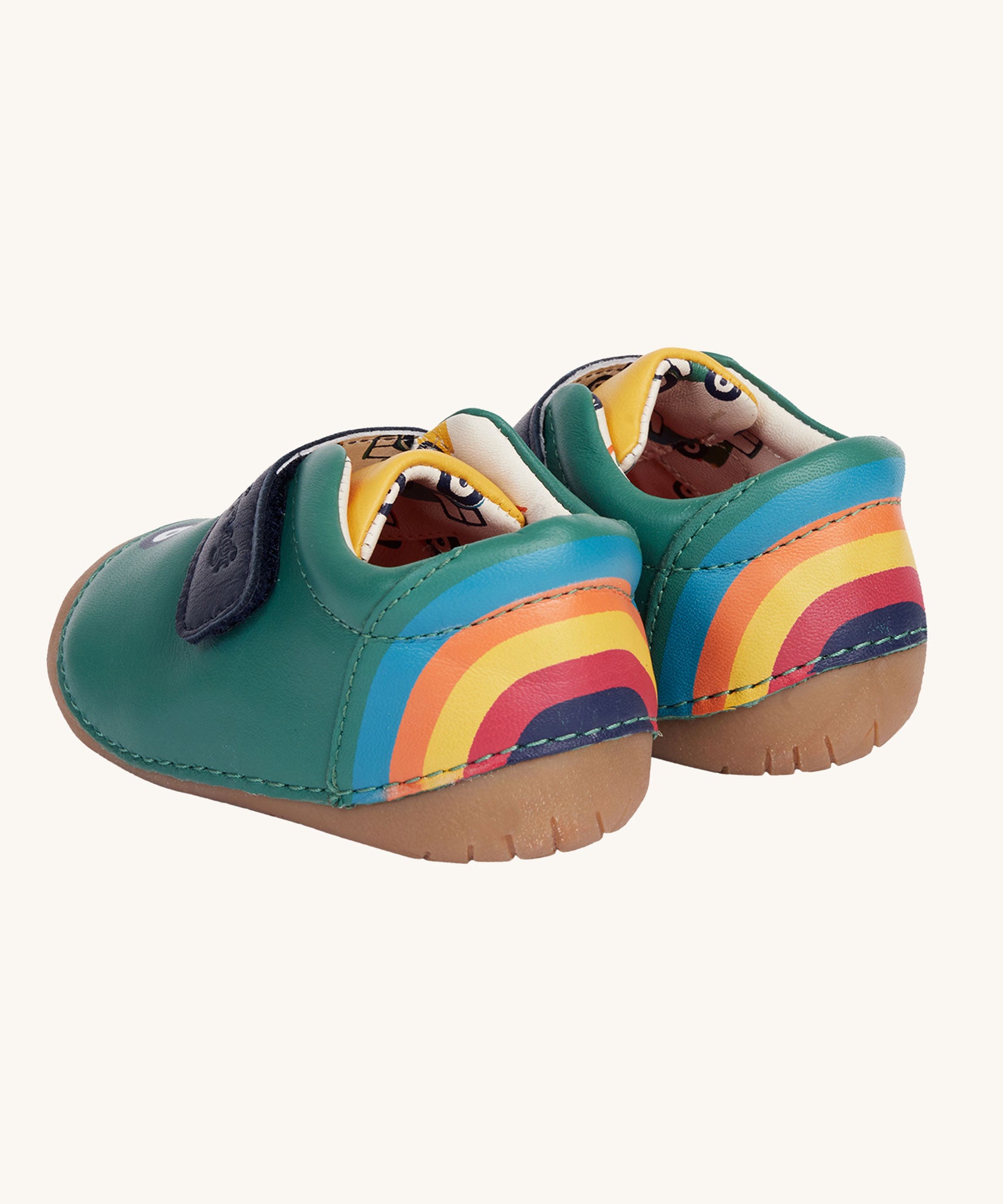 A view of the back of the Fjord First Walker leather baby holly green tractor shoes. There is a colourful rainbow on the back of the shoes. 