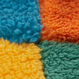 A close up of the Frugi kids fleece bucket hat in hotchpotch showing the thick fleece detai on 100% recycled polyester fabric.