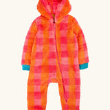 A baby's fuzzy one-piece hooded jumpsuit in a bright orange and pink plaid pattern, with contrasting teal cuffs and foot covers.