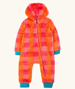 A baby's fuzzy one-piece hooded jumpsuit in a bright orange and pink plaid pattern, with contrasting teal cuffs and foot covers.