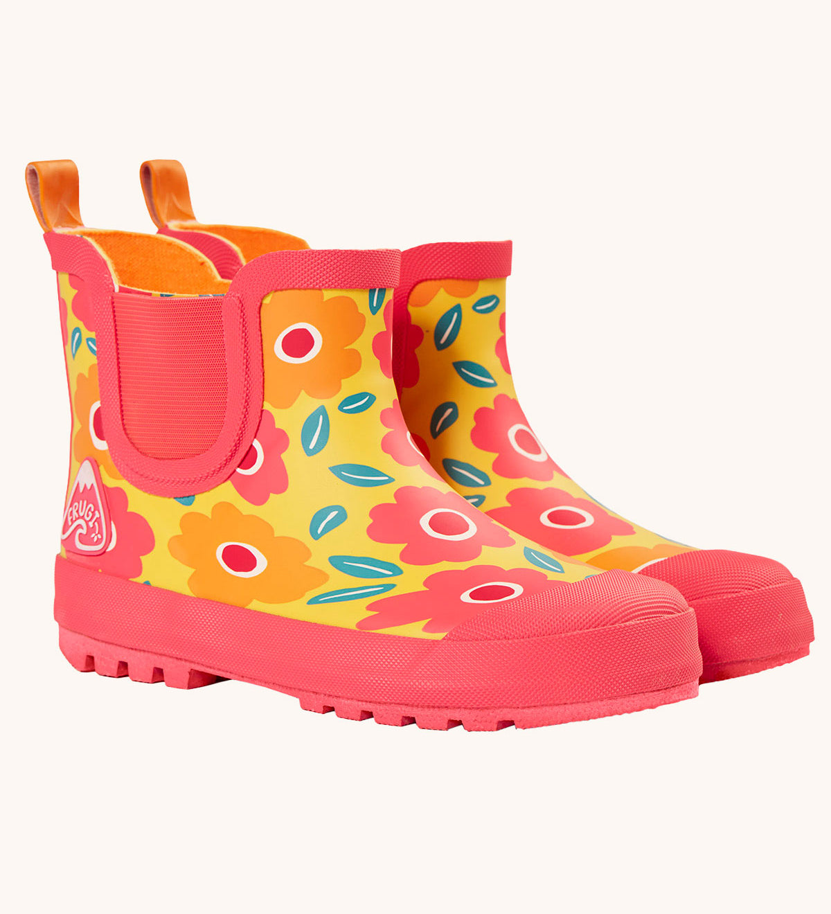 Frugi rain or shine short welly boots with a floral fields design. A yellow background  with orange and pink  flower print  and pink soles and binding.