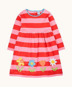 Frugi long sleeved two tone pink striped children's organic cotton dress with flower appliques. Four flower appliques across the bottom on the front of the dress.