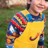 Child wearing a yellow cord dungarees with Frugi Fowey Fairisle Knitted Jumper Space Fair Isle underneath.