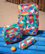 Frugi trail blazing kids backpack, matching lunch bag and pencil case in the colourful fun frenzy pattern.