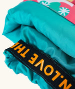 Frugi fun frenzy snow and ski salopettes showing close up of the orange elasticated cuff 