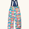 Frugi kids snow and ski salopettes fun frenzy showing a repeating rainbow and  pastel pattern design. Features removable straps and green legs cuffs