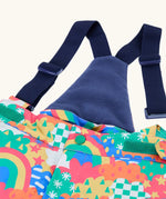 Frugi kids snow and ski salopettes in fun frenzy showing the removable navy shoulder strap and matching fleece back panel 
