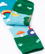 A close up of the bottom cuff on the Frugi organic cotton little knitted leggings with a fun guys red mushroom and farm design.