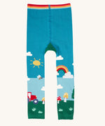 A view of the front of the Frugi organic cotton little knitted leggings with a fun guys red mushroom and farm design.