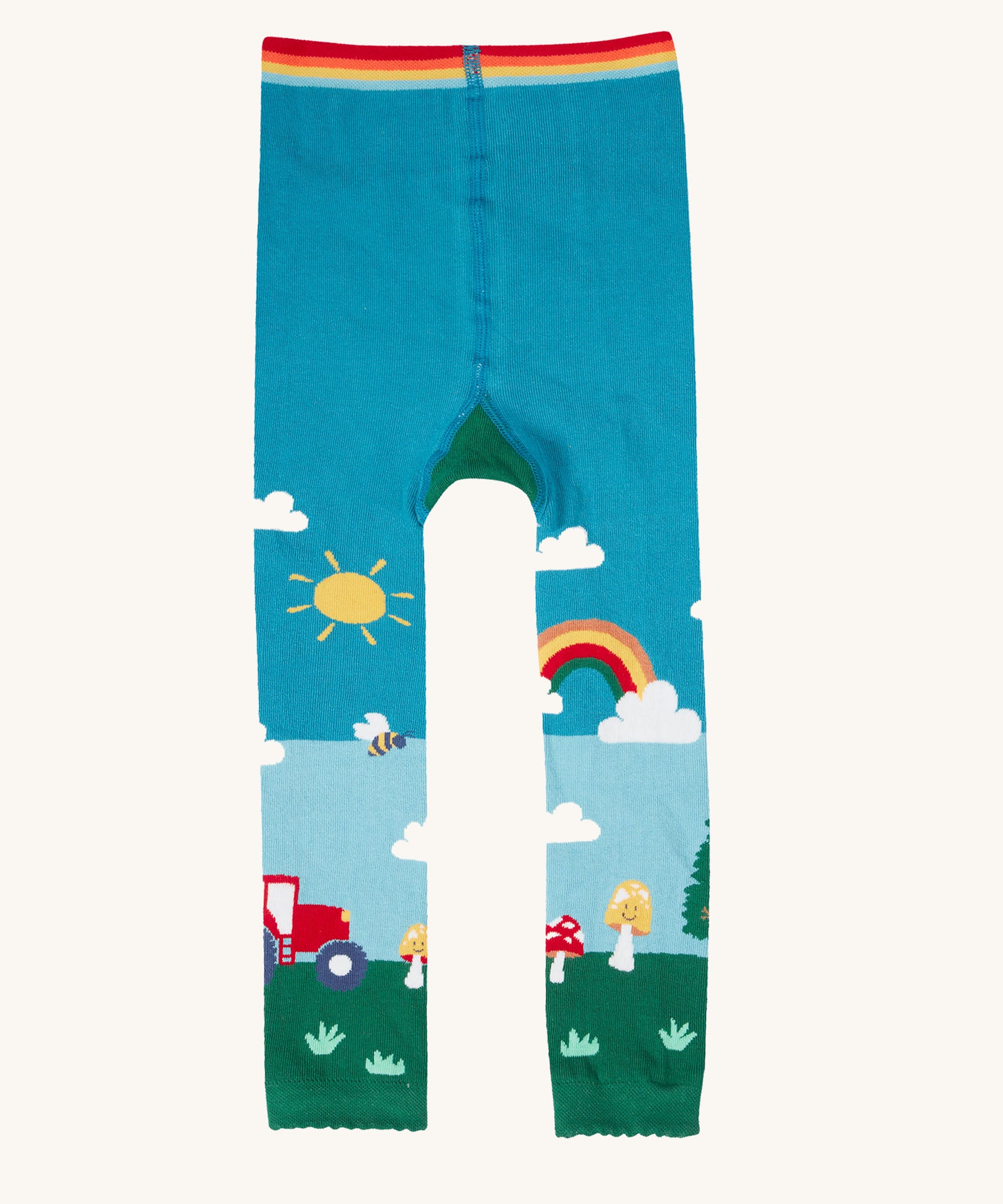 A view of the front of the Frugi organic cotton little knitted leggings with a fun guys red mushroom and farm design.