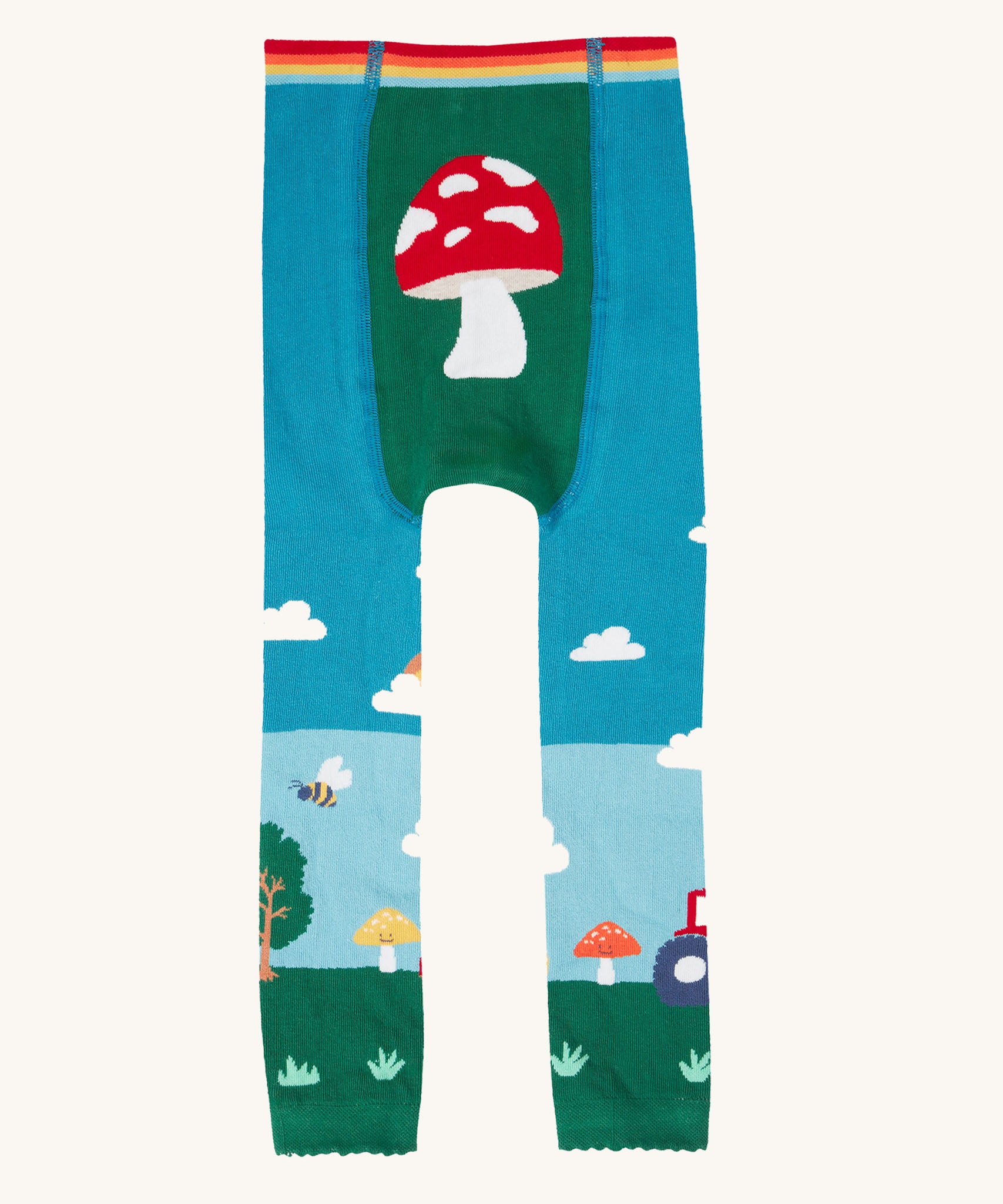 A view of the back of the Frugi organic cotton little knitted leggings with a fun guys red mushroom and farm design.