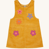 Frugi organic cotton Ginny yellow gold Corduroy Pinafore Dress with Flowers. This dress is a part of a wide range of organic cotton clothing for children available here at Babipur. 
