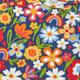 Close up of the colourful flower print on the Frugi goldie long sleeve organic cotton top in navy.