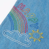 Frugi GOTS organic cotton denim trousers showing close up of a rainbow embroidery design on the leg