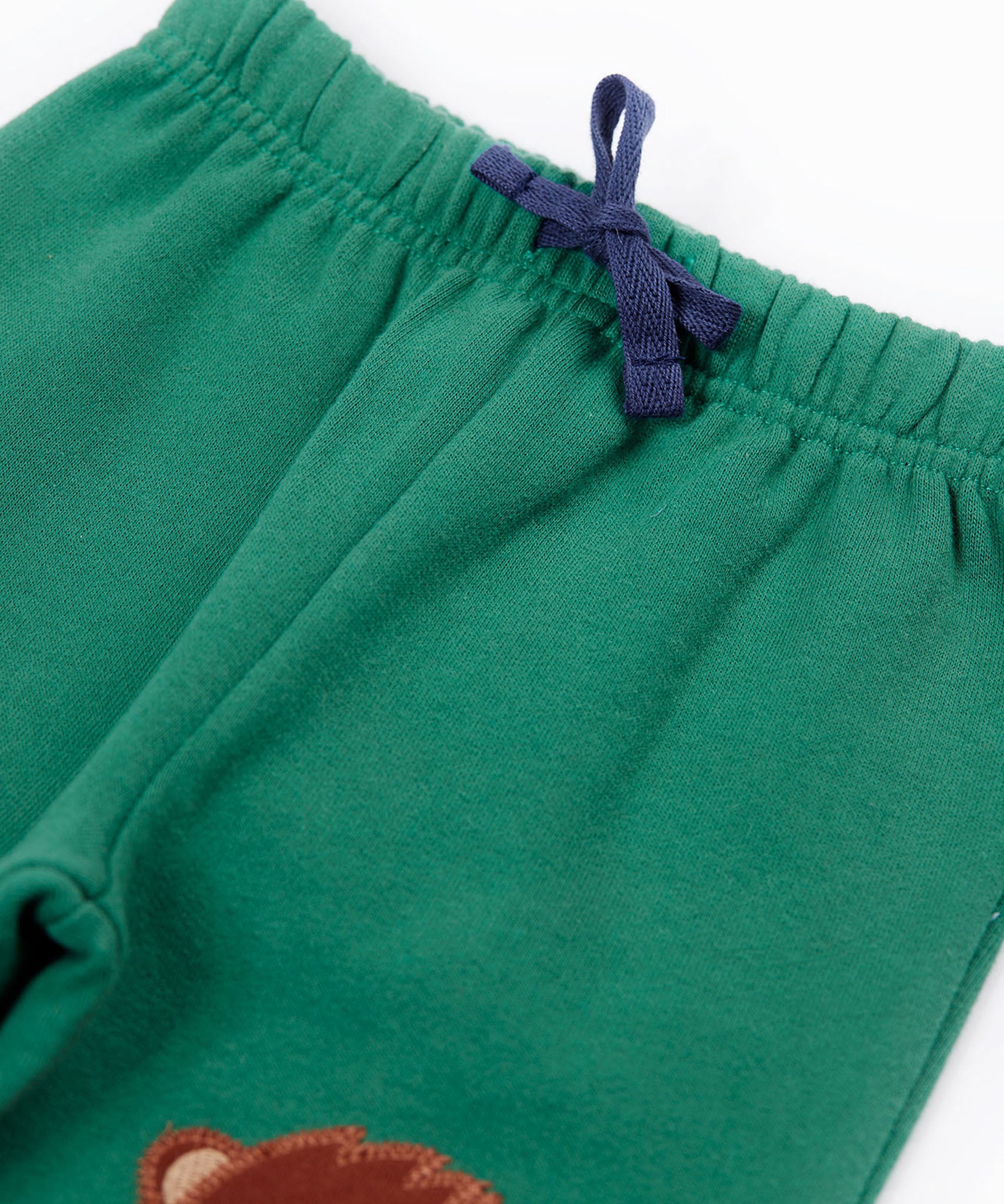 A close up of the navy coloured waist tie on the Frugi holly green coloured frog beaver crawlers kids organic ccotton joggers. 