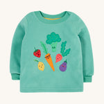 Frugi kids green fleece jumper with veg design on a cream backgroud.