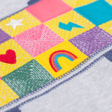A close up of the embroidered skatebaord design on the front of the Frugi Superb Stitched Skateboard sweatshirt. 