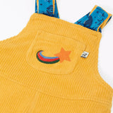 Close up of the embroidered star detail on the front chest pocket of the Frugi Gylly cord reversible dungaree in bumblebee yellow.