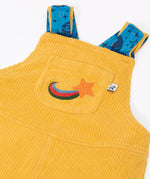 Close up of the embroidered star detail on the front chest pocket of the Frugi Gylly cord reversible dungaree in bumblebee yellow.
