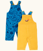 Frugi Gylly cord reversible dungaree in bumblebee yellow with star pocket design on one side and blue all over monochrome space print on the other.