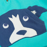 A close up of the dog applique kangaroo pocket on the front of the Frugi hadley dog blue kids hoodie.
