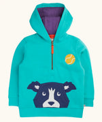 Frugi blue Hadley dog hoodie. Dog face applique incorporates a kangaroo pocket on the front. Quarter zip closre and purple lined hood.