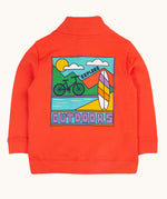 The back of the Frugi Half Zip Organic Cotton Papaya orange Jumper with large Outdoors colour block style graphic. A large square filled with an outdoor scene featuring a surfboard, bike, water, mountains and sun with the word outdoors written in bold font.