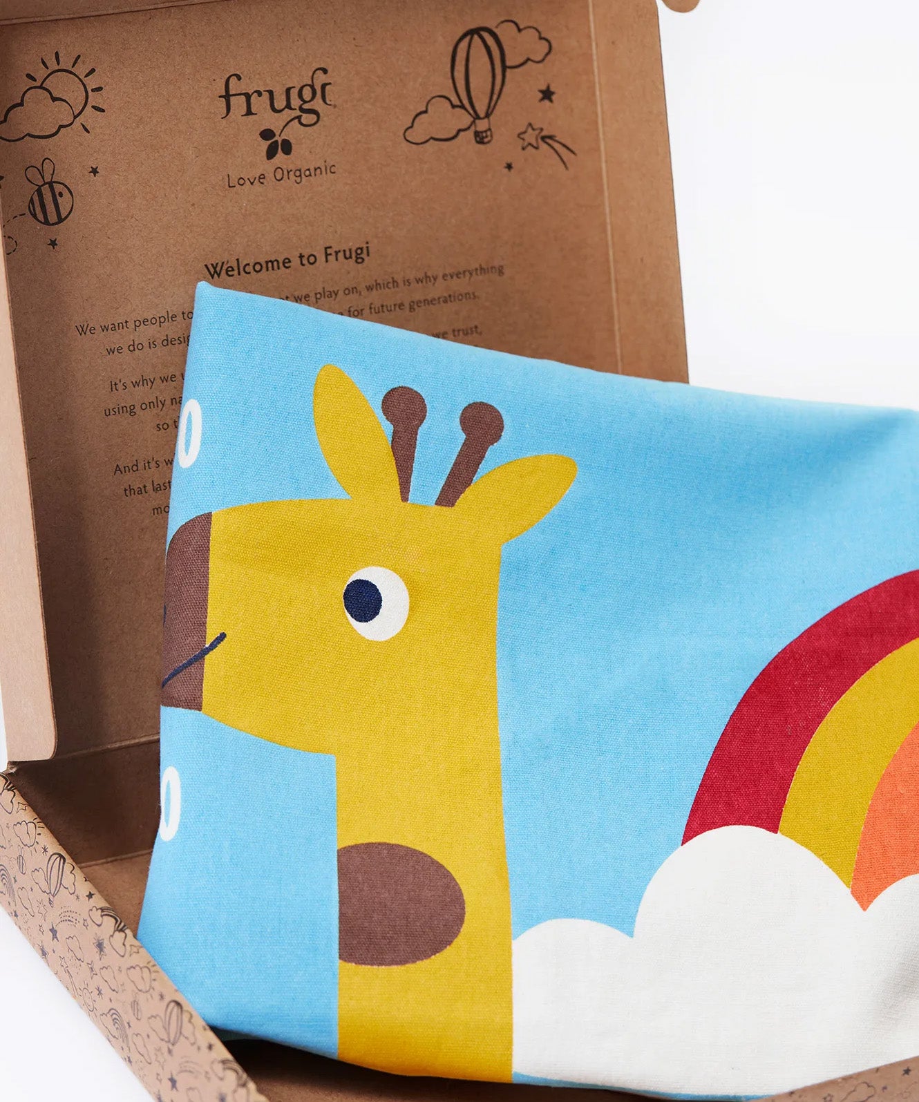 A close up image of the Frugi organic cotton kids' height chart in its cardboard gift box, showing it folded with the top of a giraffe's head illustration. 