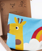 A close up image of the Frugi organic cotton kids' height chart in its cardboard gift box, showing it folded with the top of a giraffe's head illustration. 