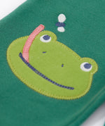 A close up of the frog applique on the knee on the Frugi holly green coloured frog beaver crawlers kids organic ccotton joggers. 
