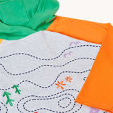 A close up of the front of the Frugi Compass Organic Cotton Hooded Top showing the orange sleeve and green hood. 