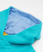 A close up of the Frugi kids oversized blue panda hoodie. Showing the light organic cotton blue lining