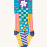 A close up of the floral inspired striped knee high sock from the Frugi kids hygge high knee socks in patchwork 2 pack. Showing the striped detail on organic cotton fabric.
