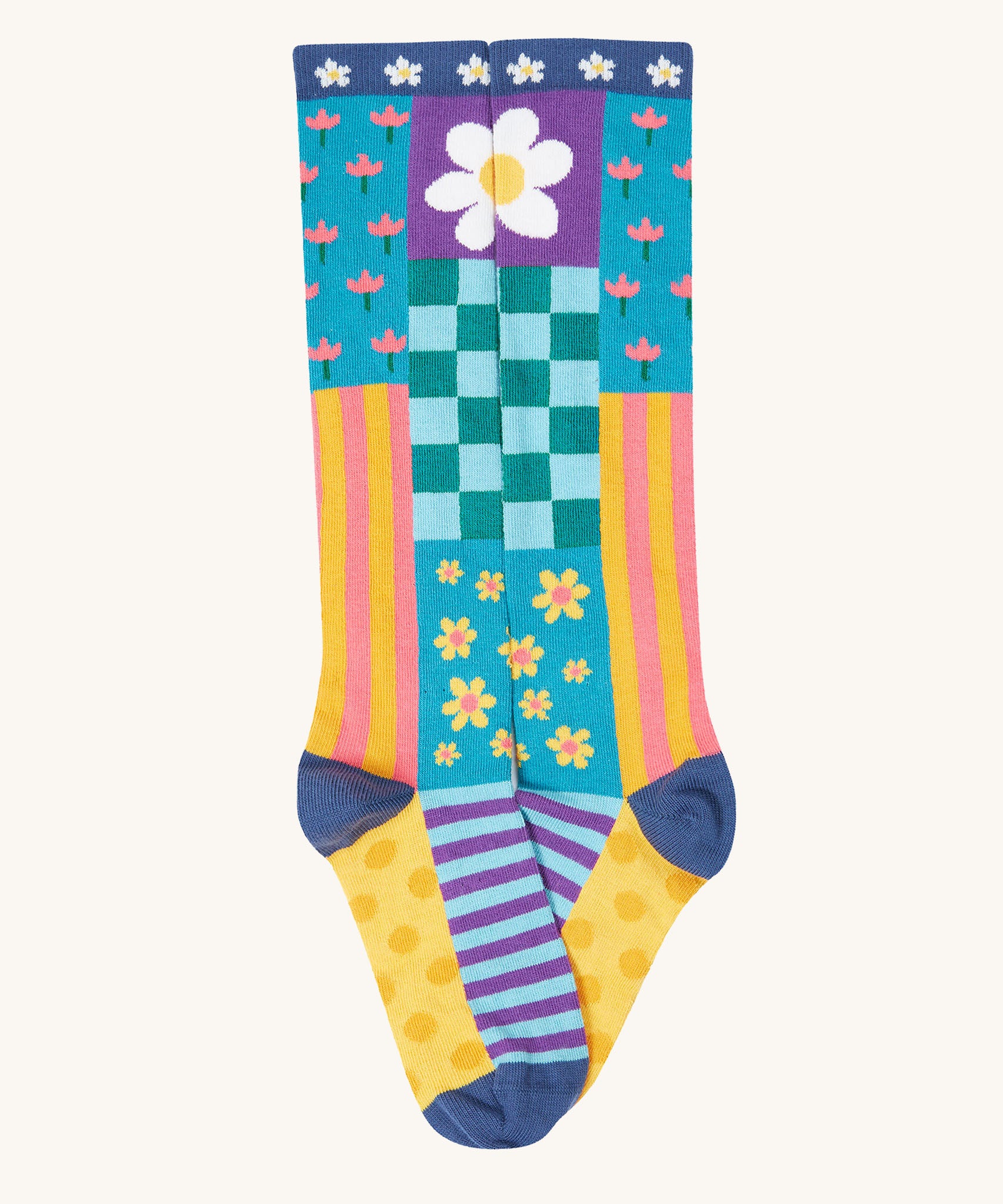 A close up of the floral inspired striped knee high sock from the Frugi kids hygge high knee socks in patchwork 2 pack. Showing the striped detail on organic cotton fabric.