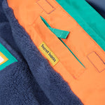 A closer look at the reflective stars on the arms of the Frugi Snow & Ski Coat - Iguana Colourblock
