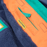 A closer look at the reflective stars on the arms of the Frugi Snow & Ski Coat - Iguana Colourblock
